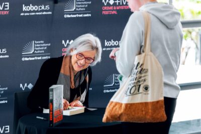 Beverley McLachlin signing a book for a fan