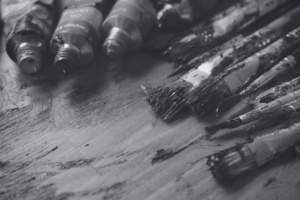 Art paint and paint brushes lying on a table